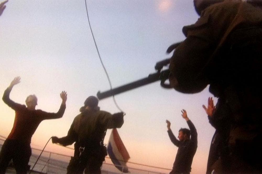 Russian Coast Guards seize the Greenpeace ship the Arctic Sunrise, following a protest by Greenpeace activists at a Russian oil platform in the Pechora Sea, off the coast of Russia. Greenpeace said Wednesday, Oct. 2, 2013 that four activists and a journalist who were detained after protesting at a Russian oil platform have been charged with piracy and could face up to 15 years in prison if found guilty. (AP)