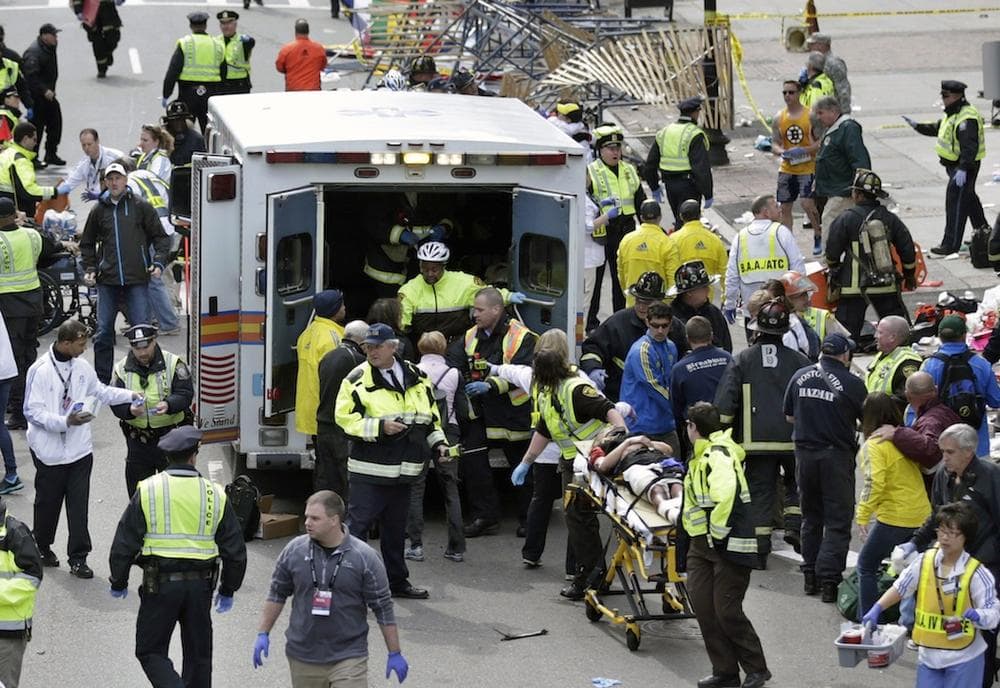 Ambulances arrive at the scene of the Marathon bombing. (AP)