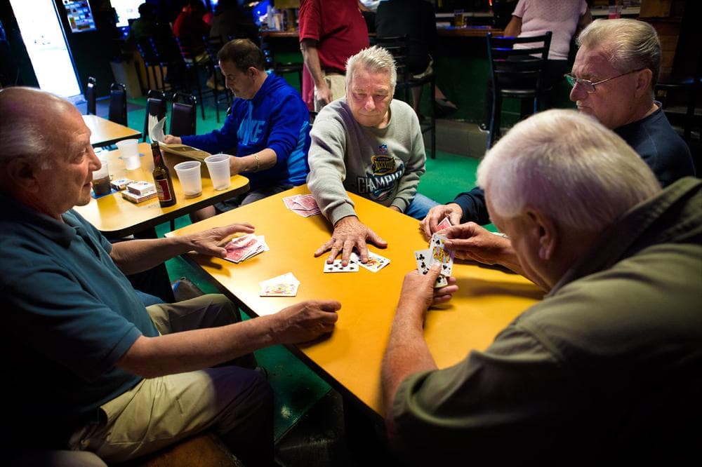 A game of whist being played at the back table of Eddie C’s. (Jesse Costa/WBUR)