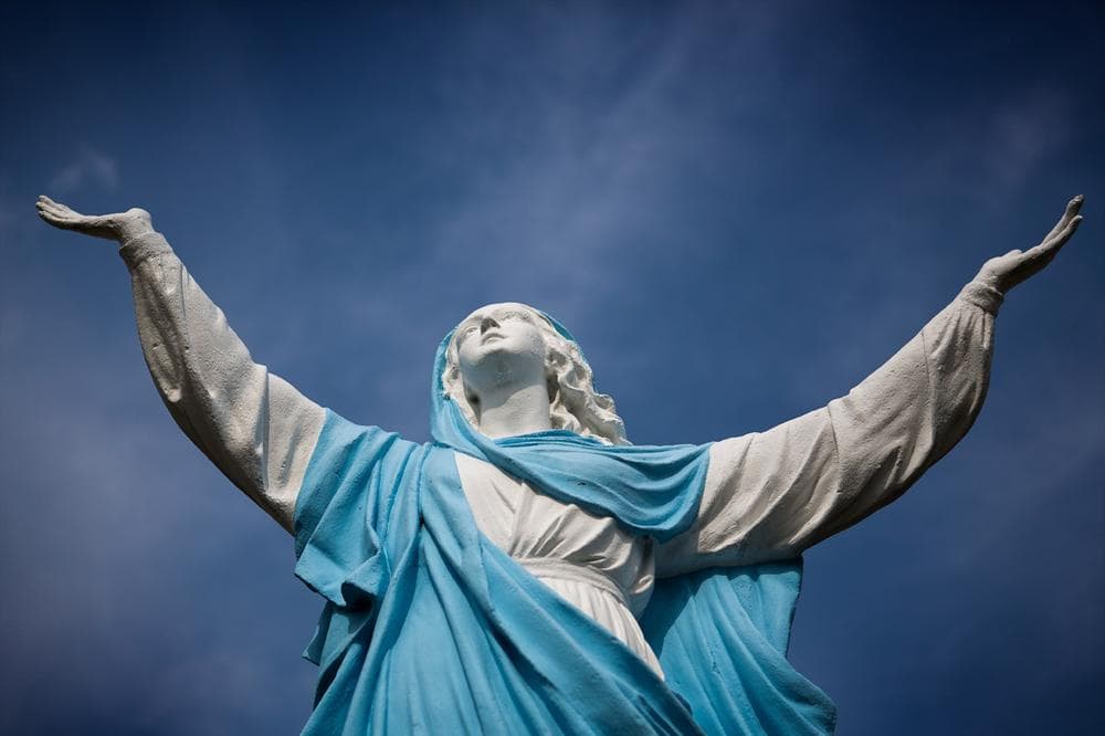 This statue sits in front of East Boston's Church of the Most Holy Redeemer. (Jesse Costa/WBUR)