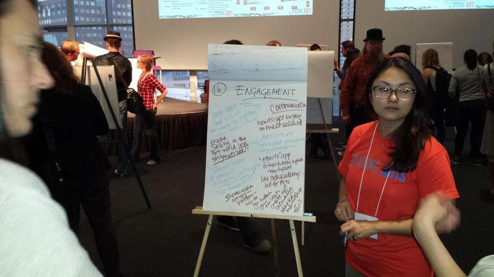 Emi Kioizumi, student at MIT Sloan School of Management, leads a discussion before the hackathon. (Franklin Einspruch)