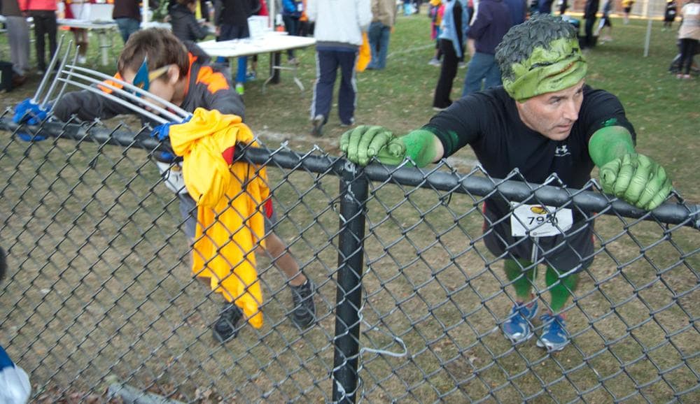 Hulk must stretch. Wolverine also gets the kinks out at Pacific Street Park before the race. (Greg Cook)