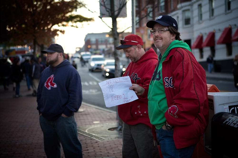 Jim Reardon of West Hartford, Conn. looks for a ticket in Kenmore Square. (Jesse Costa/WBUR)