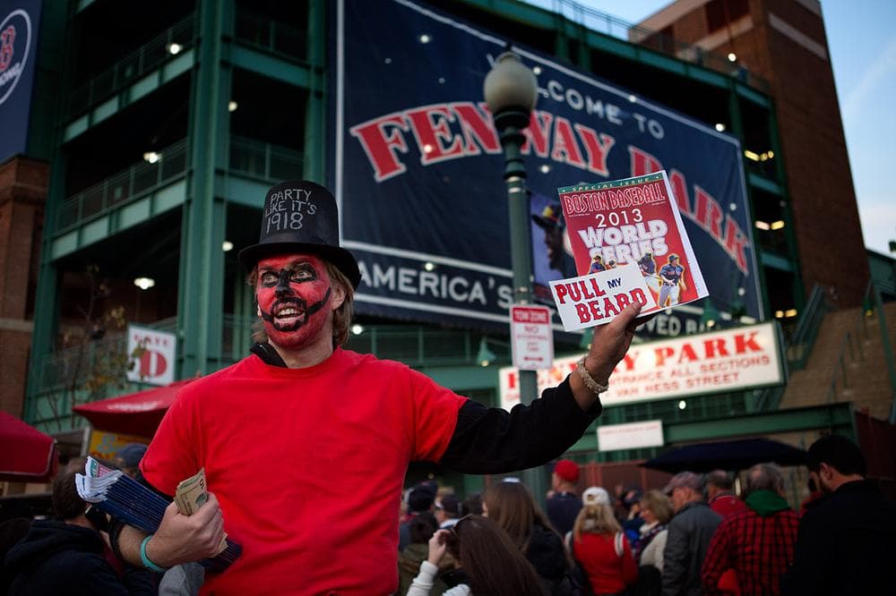 John Oveson of Roslindale looks particularly ghoulish selling programs on Yawkey Way. (Jesse Costa/WBUR)