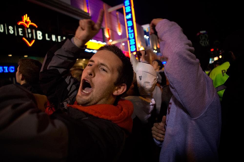 Red Sox fans react outside the House of Blues after the Sox score three runs. (Jesse Costa/WBUR)