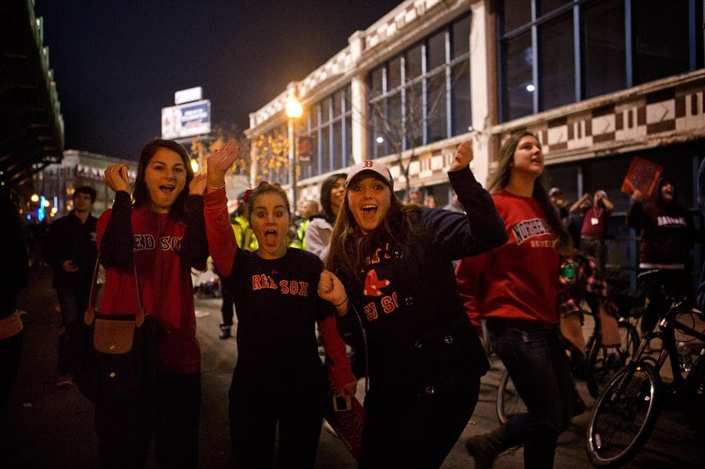 Gina Coughlin, Laura Coughlin and Ally Lambert cheer after Stephen Drew's homer. (Jesse Costa/WBUR)