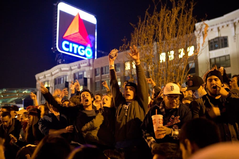 People cheer in Kenmore Square once the Red Sox clinch the World Series title. (Jesse Costa/WBUR)
