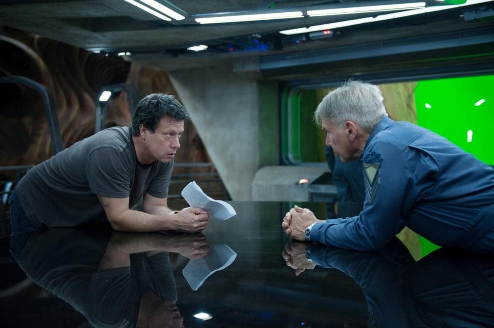 Director and screenwriter Gavin Hood (left) talks with Harrison Ford, who plays Colonel Graff on the set of the new movie "Ender's Game." (Richard Foreman Jr., SMPSP, © 2013 Summit Entertainment, LLC. All Rights Reserved.)