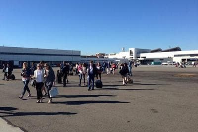 This photo was tweeted by John Forstrom with the note: "At #lax. Just had to run onto runway because of shooting in terminal 2." (John Forstrom/Twitter)