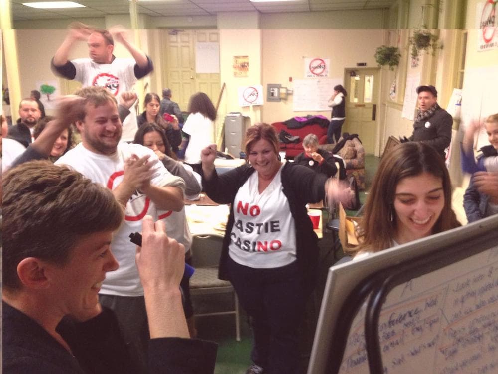 Celeste Myers, lead organizer for the "No Eastie Casino" campaign, celebrates poll reports. (Fred Bever/WBUR)