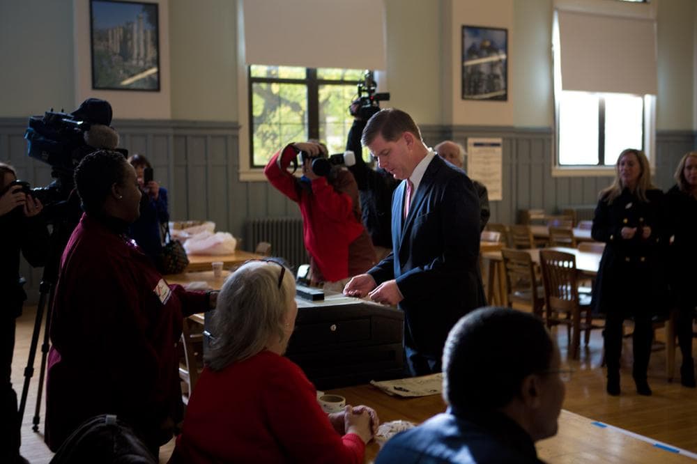 Marty Walsh casts his ballot inside the Cristo Rey High School in Savin Hill. (Jesse Costa/WBUR)