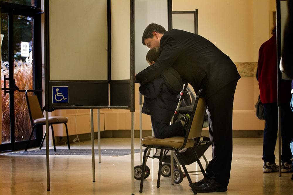 Mayoral candidate John Connolly votes with his son at St. George Orthodox Church in West Roxbury. (Jesse Costa/WBUR)