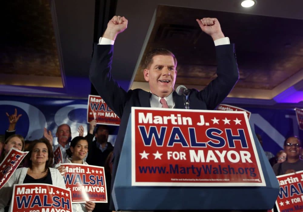 Marty Walsh gestures to supporters at his primary election night party. (Elise Amendola/AP)