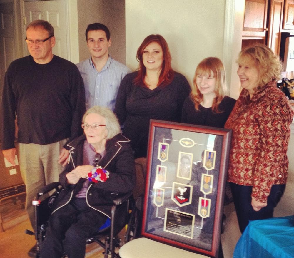 A Purple Heart is returned to the family of AO3c Gordon Yates, Nov. 9, 2013, in Narvon, Pa. Yates was killed in action on April 27, 1945. (Purple Hearts United)