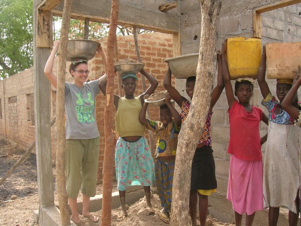 Emily Jones served in the Peace Corps in Togo from 2010 to 2012. Here she is helping construct a community library with student helpers. (Courtesy Emily Jones)