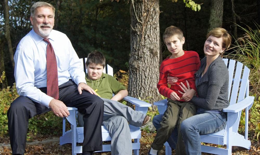 The Supple family outside their home in Natick. (Lynn Jolicoeur/WBUR)