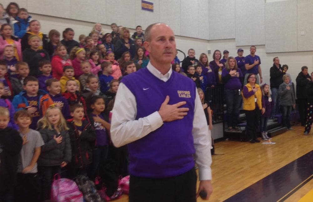 Rod Grimsley, the principal and superintendent at Gifford Grade School, leads his students in the Pledge of Allegiance, Nov. 25, 2013. (Sean Powers/WILL)