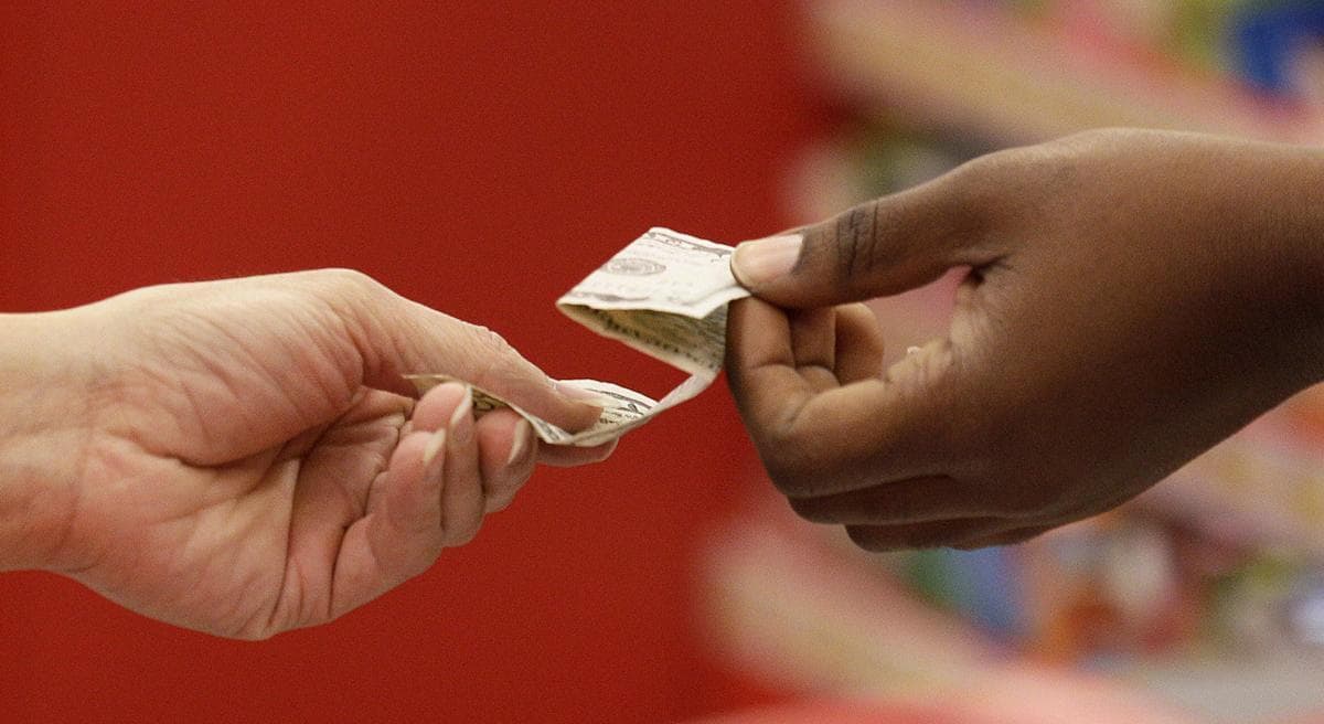 Thanksgiving is becoming just another shopping day as at least a dozen major retailers are planning to open on the holiday. It's further evidence of how little retailers value their employees. (Jeff Chiu/AP)
