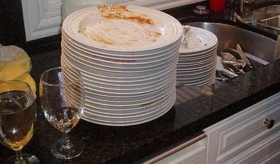 After your big holiday meal, you may ask, "Is it appropriate to ask my guests to help with the dishes?" We have answers from the Emily Post Institute. (Jenica/Flickr)