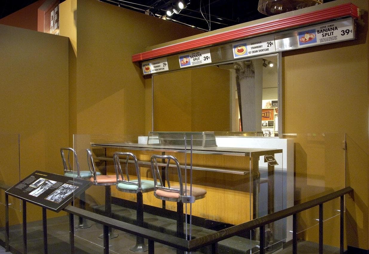 Item # 80: Greensboro lunch counter. Four African American students began a sit-in to desegregate an eatery and energize the Civil Rights movement (Hugh Talman, Smithsonian)