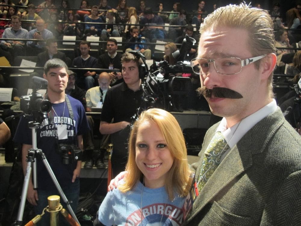 Emerson student Charlie Greenwald wears his own news anchor costume. (Andrea Shea/WBUR)