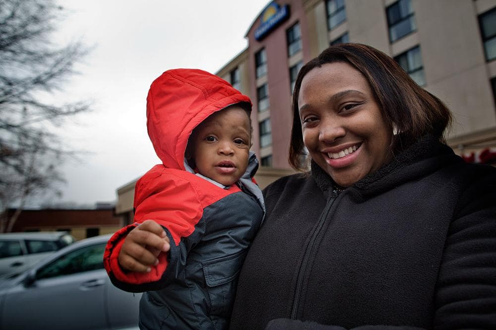 Lynnicia, 22, and her 15-month-old son, Myshon, were forced to seek emergency shelter after their federal rent subsidy expired and their landlord raised the rent to market rate. With no shelter space available, they were placed in a Brighton motel. (Jesse Costa/WBUR)