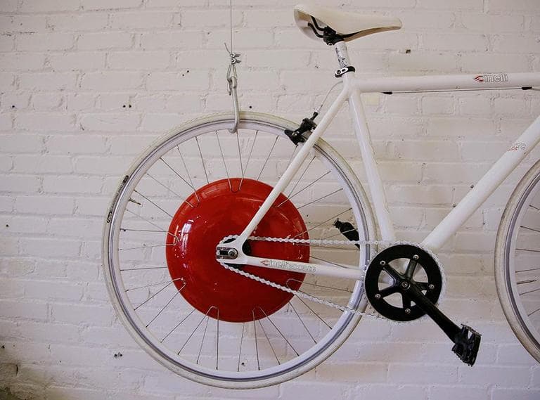 The Copenhagen Wheel packs the power to propel a rider as fast as 37 mph, but developers have put speed limits in software to meet local speed limits — 20 mph in the U.S. and 25 mph in Europe. (Stephan Savoia/AP)