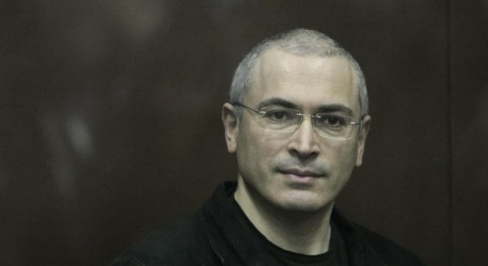 In this Thursday Dec. 30, 2010 file photo Mikhail Khodorkovsky looks from behind a glass enclosure in a court room in Moscow, Russia. Khodorkovsky, the archrival of President Vladimir Putin, has been released from prison after a decade behind bars, his spokeswoman told the Associated Press on Friday. Khodorkovsky spent 10 years in prison on politically tinted charges of tax evasion and embezzlement. (Alexander Zemlianichenko Jr./AP)