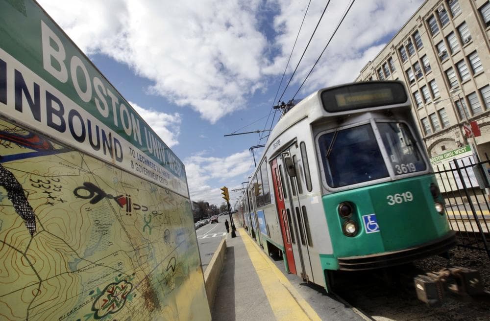 An MBTA train pulls into a stop on Commonweath Avenue near Boston University in Boston. (Elise Amendola/AP)