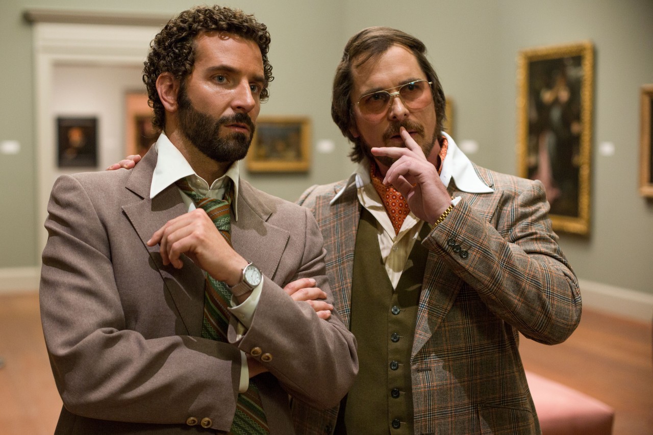 Bradley Cooper (left) as FBI Agent Richie DiMaso in the film, "American Hustle." Christian Bale, (right) as conman Irving Rosenfeld. (Sony Pictures)