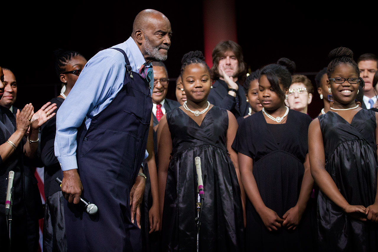 Mel King performs the musical interlude with students from the Renaissance Charter School. (Jesse Costa/WBUR)