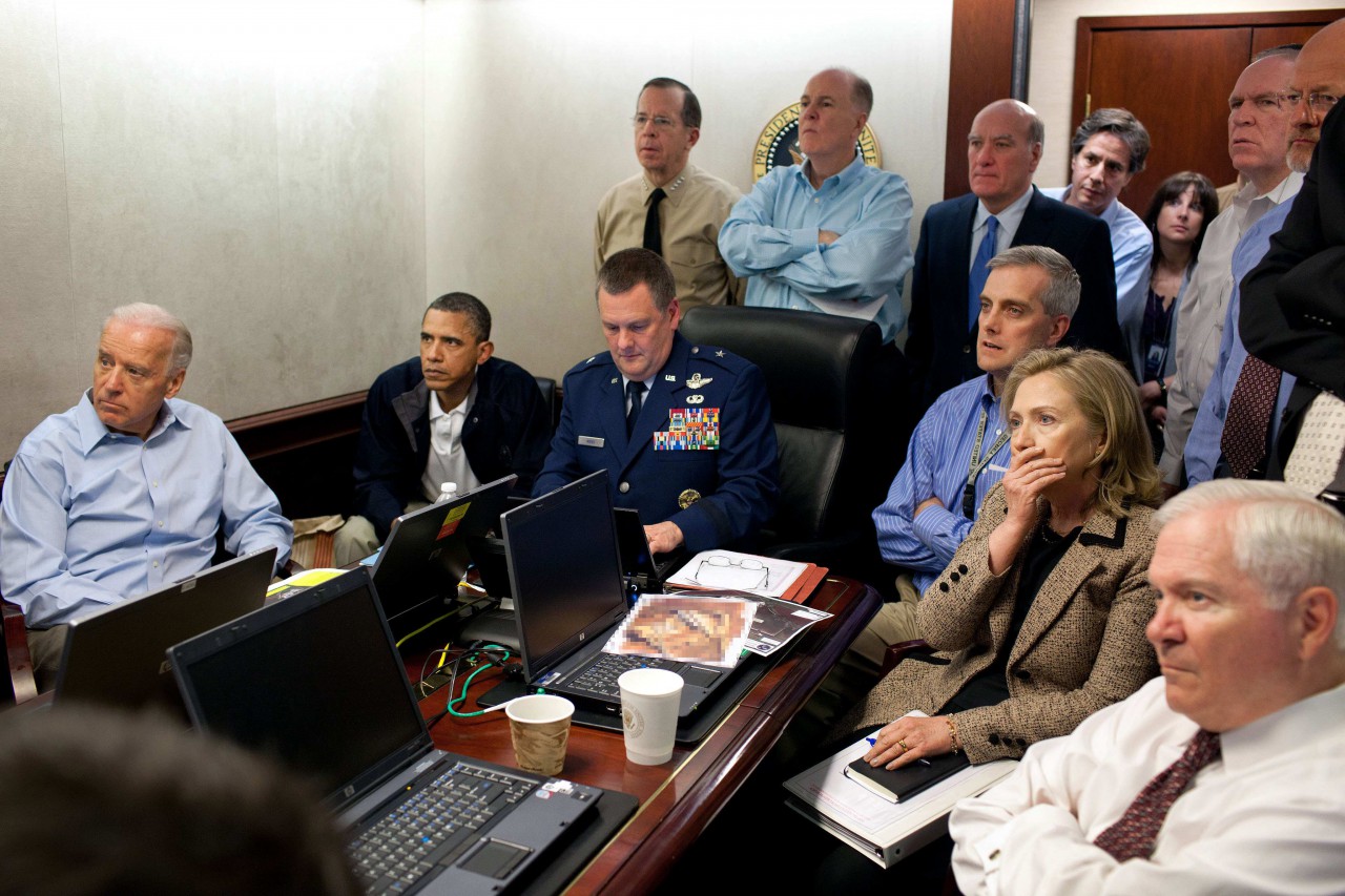 In this May 1, 2011 image released by the White House and digitally altered by the source to obscure the details of a document on the table, President Barack Obama, second from left, Vice President Joe Biden, left, Secretary of Defense Robert Gates, right, Secretary of State Hillary Rodham Clinton, second right, and members of the national security team watch an update on the mission against Osama bin Laden in the Situation Room of the White House in Washington. (Pete Souza/AP)