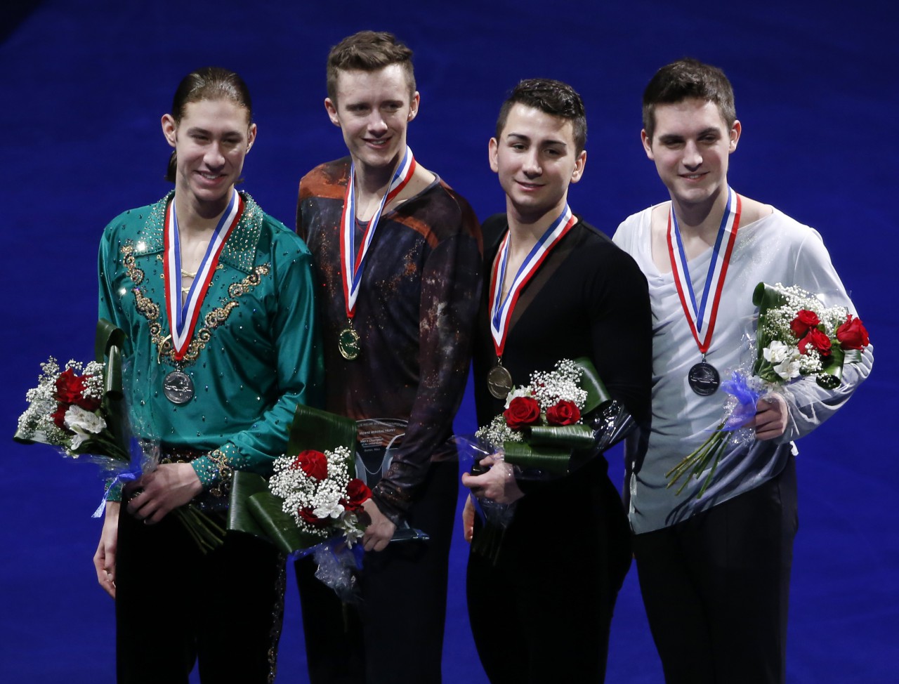 The top four men's skaters, from left, Jason Brown, second place, Jeremy Abbott, first place, Max Aaron, third place, and Joshua Farris pose on the awards stand at the medals ceremony at the U.S. Figure Skating Championships in Boston, Sunday, Jan. 12, 2014. (Elise Amendola/AP)