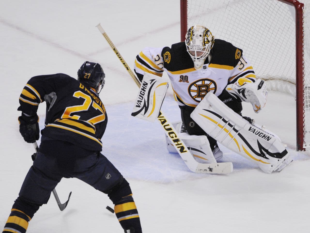Buffalo Sabres' Matt D'Agostini (27) moves in to score the game-winning goal on Boston Bruins' Chad Johnson (30) during overtime. (AP/Gary Wiepert)