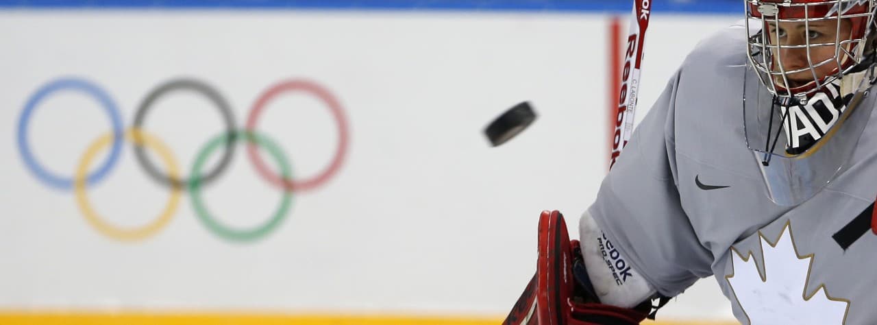 Goalkeeper of Canada's women's ice hockey team Shannon Szabados eyes a puck during a practice session ahead of the 2014 Winter Olympics, Thursday, Feb. 6, 2014, in Sochi, Russia. (Petr David Josek/SP)
