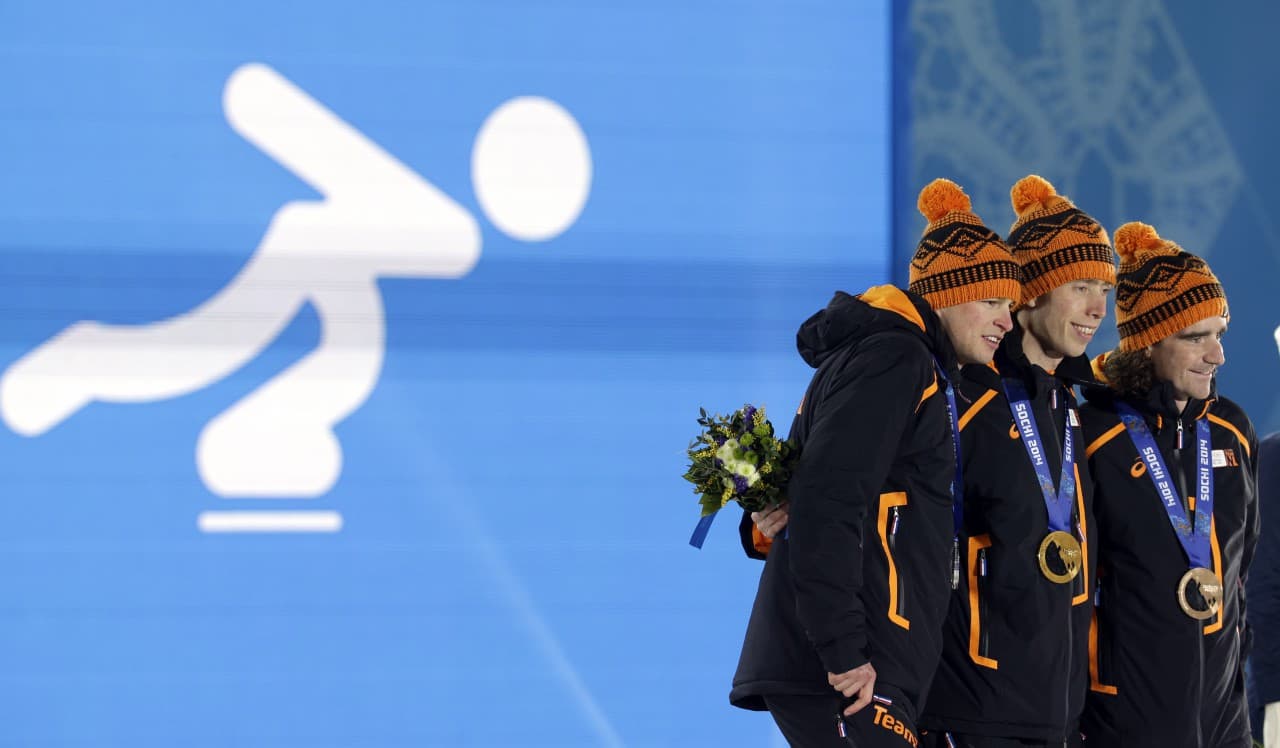 Men's 10,000-meter speedskating medalists, from left, Sven Kramer, silver, Jorrit Bergsma, gold, and Bob de Jong, bronze, all from the Netherlands, pose with their medals at the 2014 Winter Olympics in Sochi, Russia, Wednesday, Feb. 19, 2014. (Morry Gash/AP)