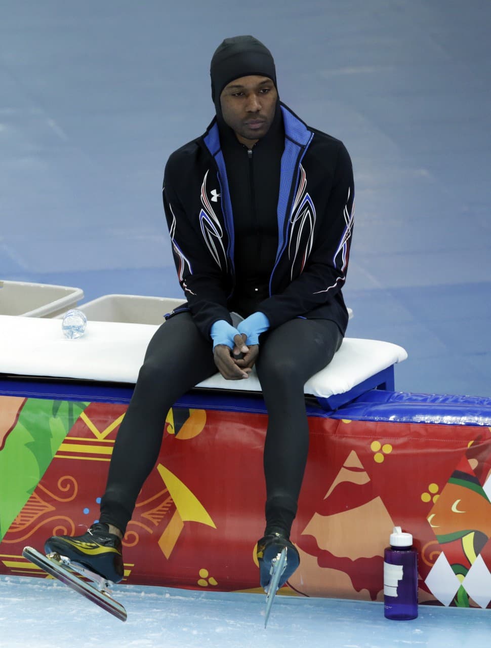 Shani Davis looks dejected after competing in the men's 1,500-meter Olympic speedskating race, Saturday, Feb. 15, 2014. (Matt Dunham/AP)