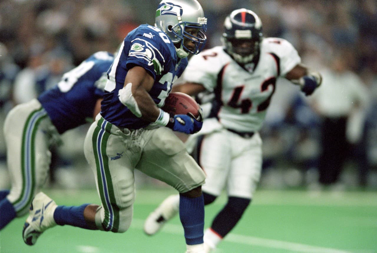 Former Seahawk Ahman Green carries the ball during a 1999 matchup between the teams played in Seattle's Kingdome. (Otto Greule Jr./Getty)  