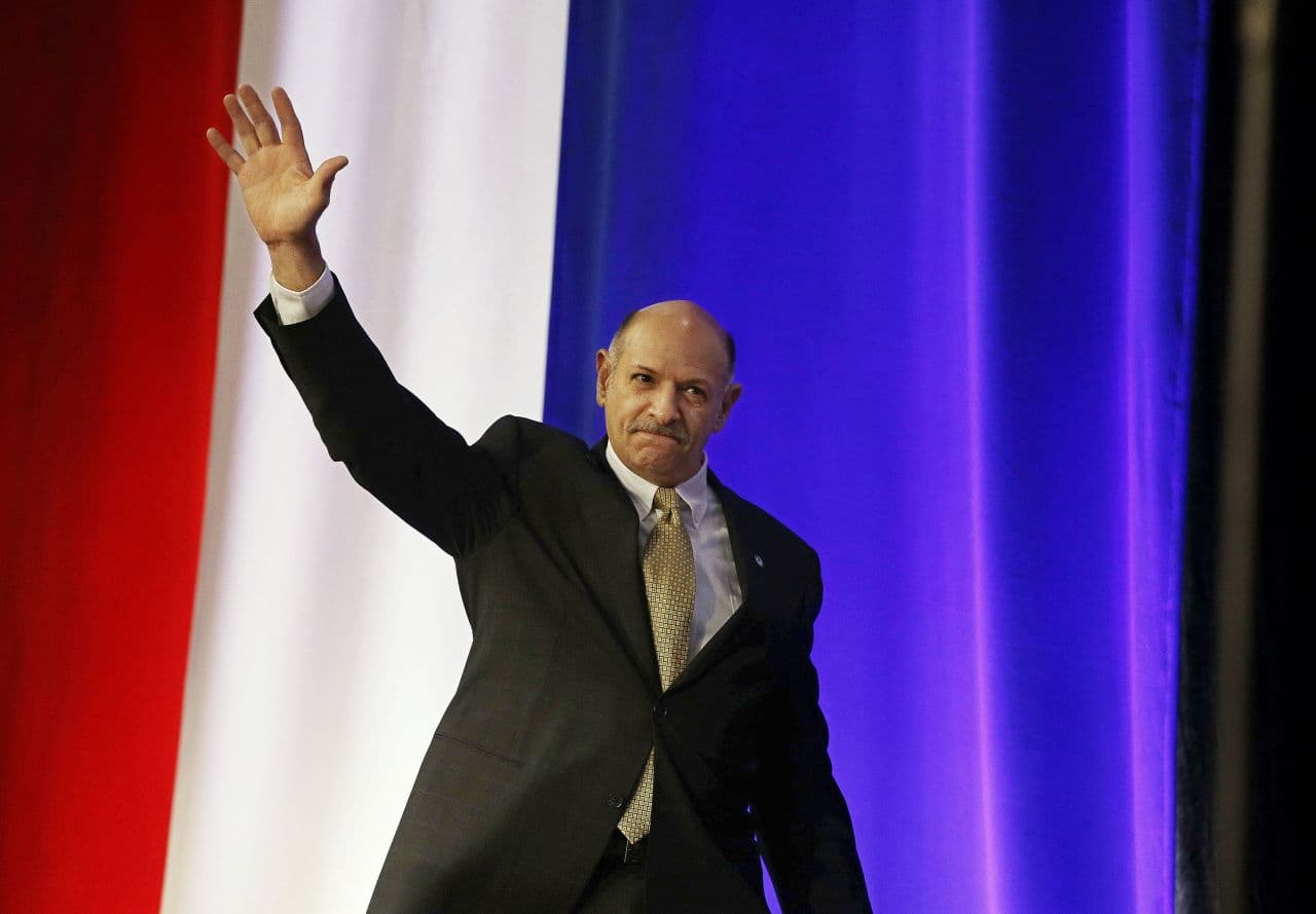 Mark Fisher, the Tea Party nominee for governor, greets attendees at the Republican state convention in Boston last month. (Stephan Savoia/AP)
