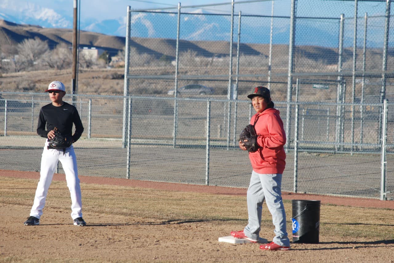 Players for Naat'aanii, a team created for Navajo youth, practice in Farmington, N.M., beneath Colorado’s La Plata Mountains. (Ken Shulman/OAG)