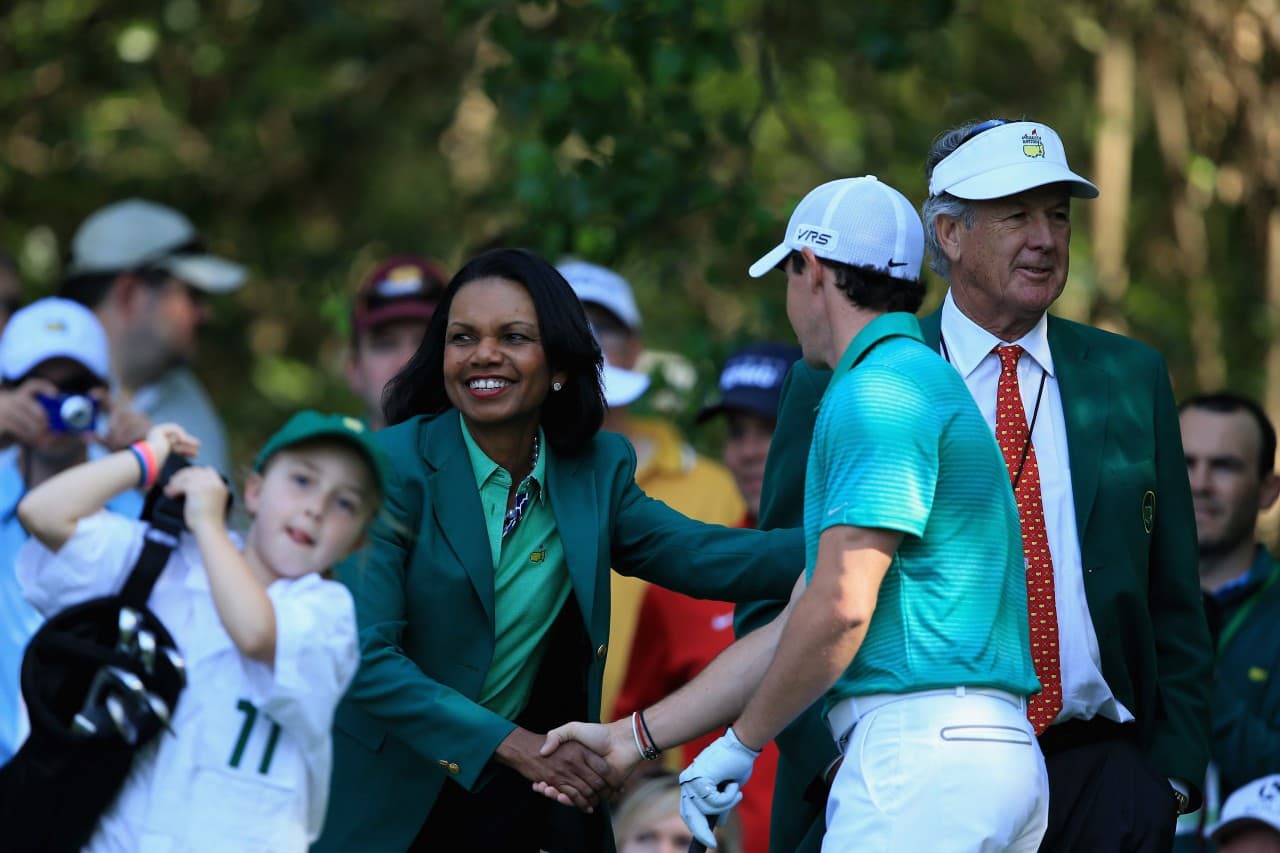 Augusta National member Condolezza Rice greats Rory McIllroy and children partaking in the Hit, Putt event. (David Cannon/Getty Images)