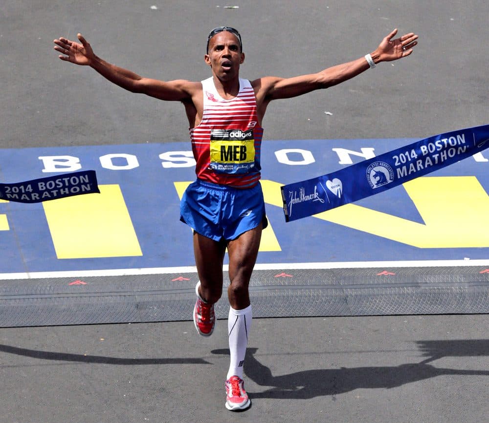 Meb Keflezighi, of San Diego, Calif., breaks the tape to win Boston Marathon. 