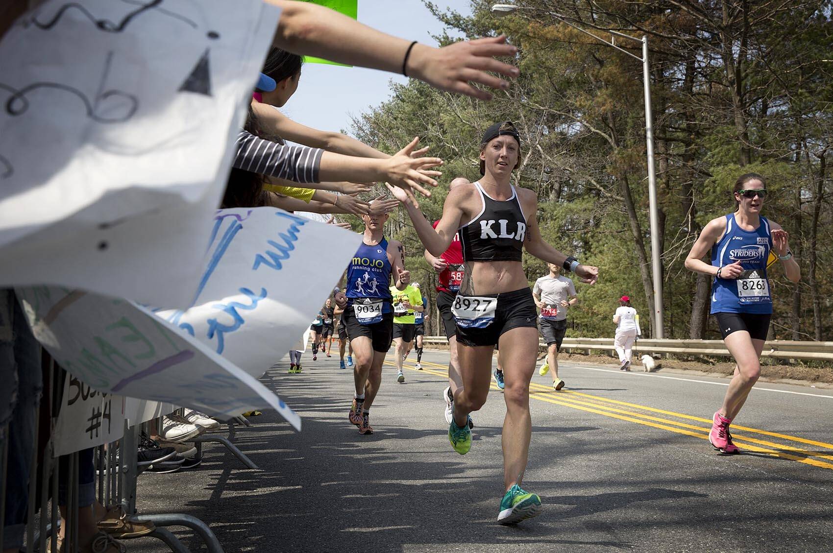 Boston Marathon runners pass through the "scream tunnel" in Wellesley in 2016. (Robin Lubbock/WBUR)