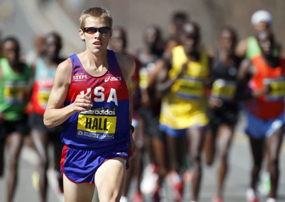 Ryan Hall runs ahead of an elite group of runners in the 2011 Boston Marathon. Hall went on to finish fourth in the race. (Steven Senne/AP)