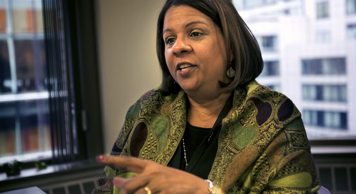 Following the deaths of three children, Olga Roche, the embattled head of Massachusetts' child welfare agency, resigned this week under mounting pressure. But Eileen McNamara says this simplistic move isn't the solution. Roche is pictured in March 2014. (Jesse Costa/WBUR)