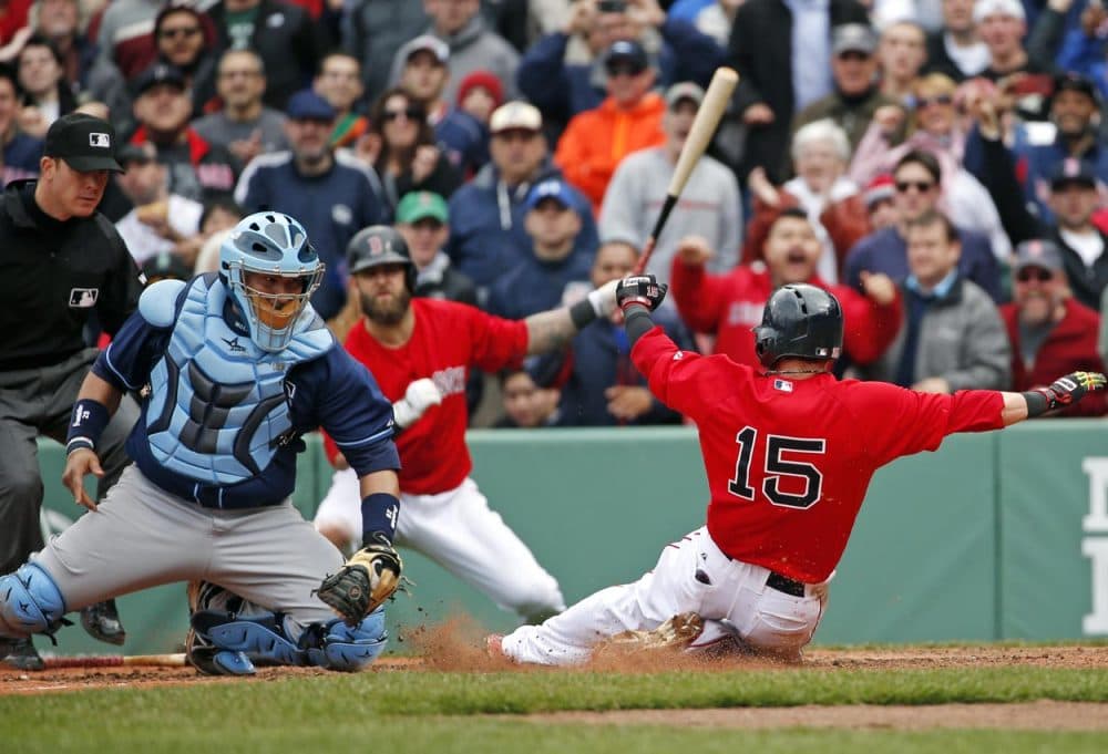 Rays catcher Jose Molina moves to tag out Red Sox' Dustin Pedroia, trying to score on a double by DH David Ortiz Thursday afternoon. (Elise Amendola/AP)