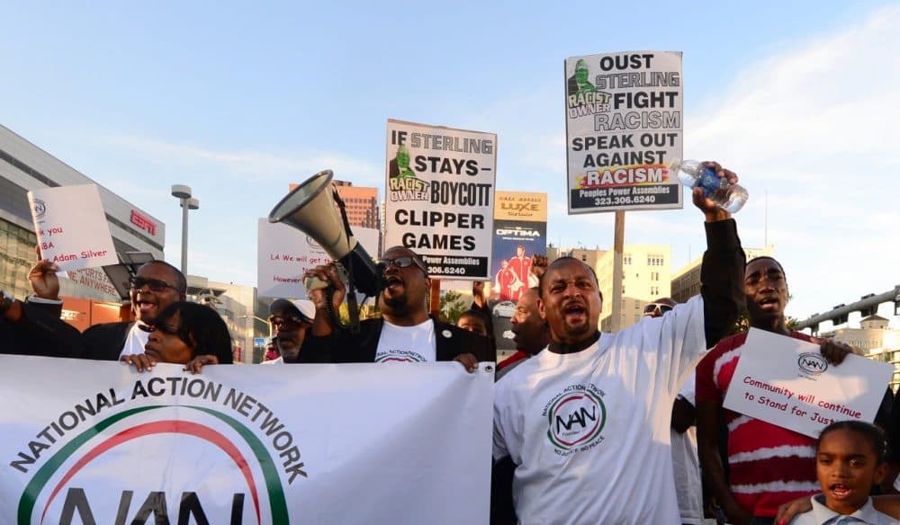 Protesters gathered outside the Staples Center to protest Donald Sterling. (FREDERIC J. BROWN/AFP/Getty Images)