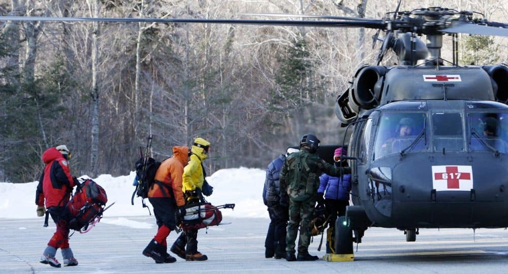In this Jan. 22, 2007 file photo, a search-and-rescue team boards a helicopter to head to the top of Mount Lafayette to look for a missing hiker in Franconia, N.H. (Jim Cole/AP)