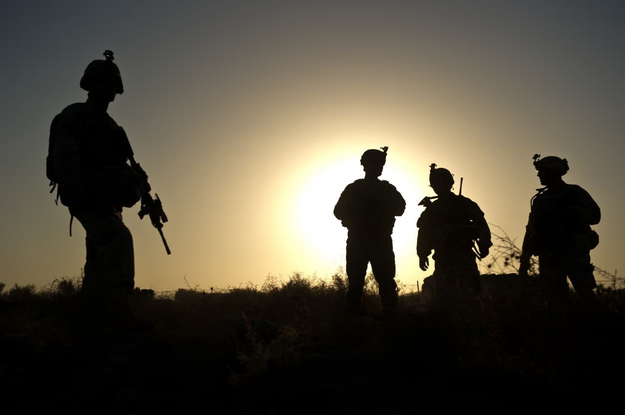 U.S. soldiers of the 502nd Infantry regiment 2nd Batallion 3rd Platoon of the Charger Company, stand at a checkpoint around Lakokhel camp in the Zari district of Kandahar city on December 02, 2010. (Martin Bureau/AFP/Getty Images)