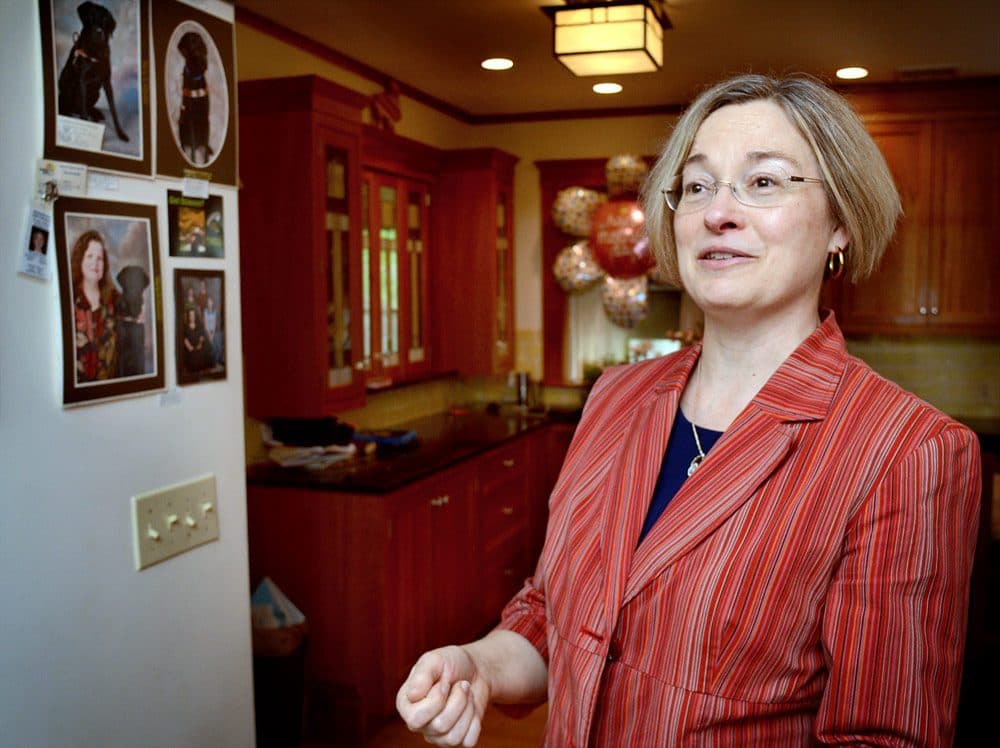 Michelle Binzel, 55, of Lexington, is an unemployed management professor. (Robin Lubbock/WBUR)